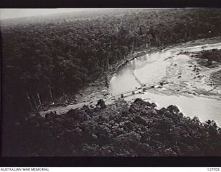 PURIATA RIVER AREA, BOUGAINVILLE ISLAND. 1945-07-28. PHOTOGRAPH TAKEN BY NO. 5 SQUADRON, RAAF, OF THE MCKENNA BRIDGE OVER THE PURIATA RIVER, CONSTRUCTED BY ROYAL AUSTRALIAN ENGINEERS