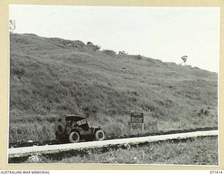 FLAT TOP FEATURE, FINSCHHAFEN AREA, NEW GUINEA. 1944-03-21. THE BATTLE SIGN MARKING THE ADVANCE OF THE 29/46TH AND THE 22ND INFANTRY BATTALIONS, 4TH INFANTRY BRIGADE GROUP ON THE 1943-12-07