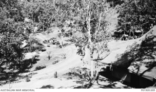 Brigade Headquarters of the 73rd Anti-Aircraft Searchlight Battery in the Port Moresby area, seen from above the road