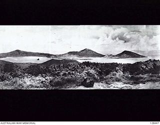 SIMPSON HARBOUR, NEW GUINEA. C.1946. THE HARBOUR FRONTING RABAUL CAPITAL OF THE MANDATED TERRITORY OF NEW GUINEA, VIEWED FROM TALILIGAP ON THE KOKOPOP RIDGE ROAD. (PHOTOGRAPH REPRODUCED IN OFFICIAL ..