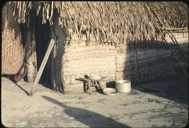 Showing details of houses: note coconut-scraping stool (4) : Mortlock Islands, Papua New Guinea, 1960 / Terence and Margaret Spencer