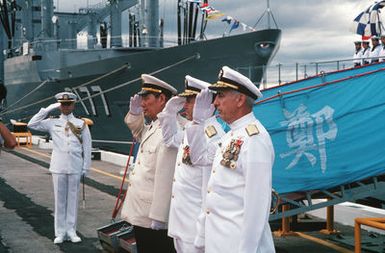 Vice Admiral (VADM) Ma Xin Chun, Commander of the Chinese North Sea Fleet, 2nd from left, Admiral (ADM) David Jeremiah, Commander-in-CHIEF, US Pacific Fleet, (center), and VADM James Dorsey Jr., Commander, US Third Fleet, salute at ceremonies of the visiting Chinese training ship ZHENG HE