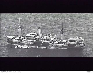1943-01-01. AERIAL PORT SIDE VIEW OF THE DUTCH CARGO VESSEL SS REIJNST WHICH AS PART OF CONVOY MS.2A FERRIED AUSTRALIAN TROOPS FROM RATAI BAY, JAVA, WHENCE THEY HAD BEEN BROUGHT BY THE LARGE ..