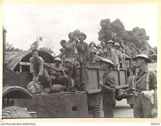 TOROKINA, BOUGAINVILLE. 1945-09-14. A PARTY OF 79 CHINESE ARRIVING AT TOROKINA COMPOUND BY TRUCK. FORMER PRISONERS OF THE JAPANESE THEY WERE RELEASED WHEN AUSTRALIAN TROOPS OCCUPIED THE JAPANESE ..