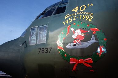 Santa nose art painted on a C-130 Hercules aircraft of the 374th Airlift Wing commemorates the 40th anniversary of the Christmas air drops to islanders of the Federated States of Micronesia. Crews from the 345th and 21st Airlift Squadrons are assigned to fly the C-130 for the Christmas Drop '92 missions. Every Christmas since 1952, food, clothing, tools and toys donated by residents of Guam have been delivered by air to 40 Micronesian islands