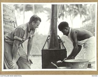 MIRAVASI (MINVASI?), NEW GUINEA. 1943-06-29. COOKS AT THE ENGINEERS' CAMP OF THE 2/4TH AUSTRALIAN FIELD SQUADRON, ROYAL AUSTRALIAN ENGINEERS, NX91567 SAPPER J. HODGE (LEFT) AND MEERO (RIGHT), ..