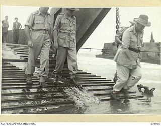 AITAPE, NEW GUINEA. 1945-03-23. LORD WAKEHURST, KCMG, GOVERNOR OF NEW SOUTH WALES (2) AND LIEUTENANT- COLONEL LAND, COMMANDER 3RD AUSTRALIAN BASE SUB- AREA LEAVE AN AMERICAN LCT (LANDING CRAFT ..