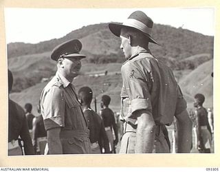 NADZAB AREA, NEW GUINEA, 1945-06-27. HIS ROYAL HIGHNESS, THE DUKE OF GLOUCESTER, GOVERNOR GENERAL OF AUSTRALIA (1), TALKING WITH SGT R.S. STUBBS (2), AN INSTRUCTOR, DURING HIS INSPECTION OF PACIFIC ..
