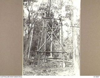 1942-10-09. AUSTRALIAN ENGINEERS ARE CONTINUALLY DEVISING NEW METHODS TO OVERCOME DIFFICULTIES OF SUPPLY TO TROOPS IN THE FORWARD AREAS IN NEW GUINEA. THIS PICTURE SHOWS THEM AT WORK ON THE ..