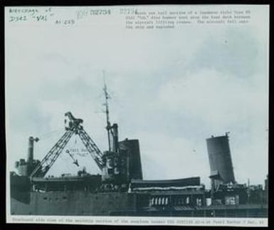 [Starboard Side View of the USS Curtiss With Wreckage of Aichi D3A]