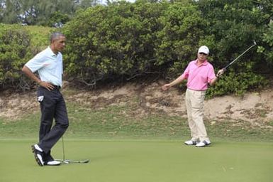 Barack Obama plays golf with Prime Minister Najib Razak, Joe Paulsen, and Mike Brush in Kaneohe Bay, Hawaii, December 24, 2014