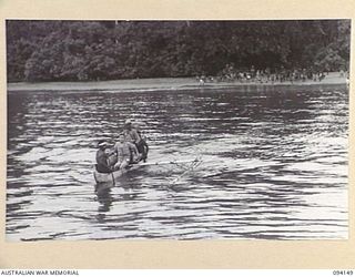 TINIAN, BOUGAINVILLE, 1945-07-18. JAPANESE PRISONERS OF WAR BEING FERRIED ACROSS TO THE ALLIED INTELLIGENCE BUREAU MOTOR LAUNCH ML1327, DURING THE RESCUE OF NETHERLANDS EAST INDIES PERSONNEL FROM ..