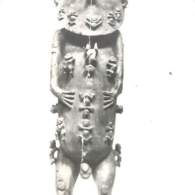 Photo of carving of a wooden male figure