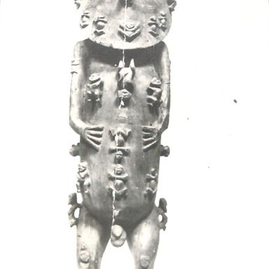 Photo of carving of a wooden male figure