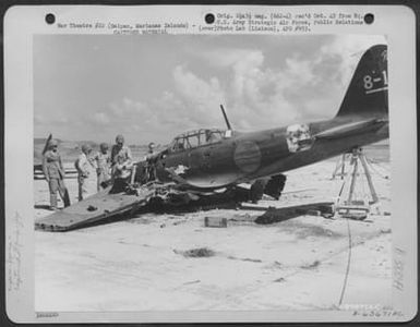 Air Force Pilots Looking Over A Damaged Japanese Zero At An Airfield On Saipan, Marianas Islands, 23 June 1944. (U.S. Air Force Number A63671AC)