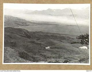 LAKES AREA, RAMU VALLEY, NEW GUINEA. 1944-01-01. VIEW FROM BERT'S POST LOOKING DOWN ON THE LAKES AREA. HEADQUARTERS 21ST INFANTRY BRIGADE CAN BE SEEN ON THE LEFT, WHILE BELOW AGAIN IS THE 2/14TH ..