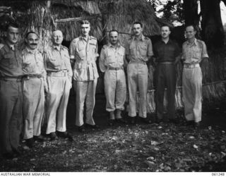 DUMPU, NEW GUINEA. 1943-12-01. SENIOR OFFICERS OF THE 7TH AUSTRALIAN DIVISION. THEY ARE: WX3396 MAJOR P. S. SMITH, DEPUTY ADJUTANT AND QUARTERMASTER GENERAL (1); W1565 MAJOR H. A. SOLOMON, DEPUTY ..