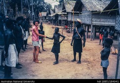 European woman shaking hands with Papua New Guinean