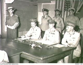 THE SOLOMON ISLANDS, 1945-09-08. THE ALLIED DELEGATION DURING THE SURRENDER CEREMONY AT II AUSTRALIAN CORPS HEADQUARTERS AT TOROKINA, BOUGAINVILLE ISLAND. IDENTIFIED PERSONNEL ARE BRIGADIER ..