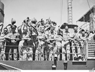 BRISBANE, QLD. 1944-10. FORMER POWS ABOARD THE "MONADNOCK", A USN MINELAYER. THE VESSEL CARRIED RESCUED AUSTRALIAN AND AMERICAN POWS FROM GUADALCANAL TO AUSTRALIA