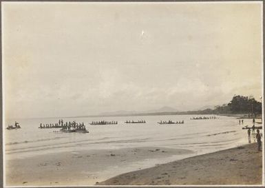 Scenes around Wanigella [Wanigela], [people in boats paddling out to sea from the beach] Frank Hurley