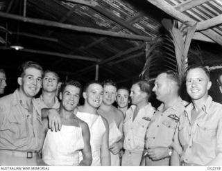 PORT MORESBY, NEW GUINEA. C. 1944. GROUP PORTRAIT OF THE MESSING STAFF WHO PREPARED THE MEAL FOR A COMBINED DINNER IN THE OFFICERS' MESS