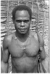 Young man with shell money and dolphin teeth necklace