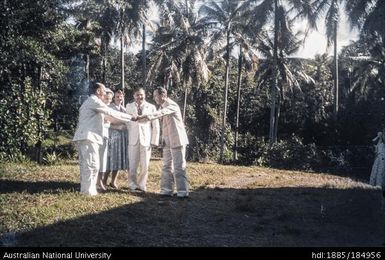 Group of European men and women shaking hands