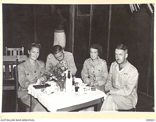LAE, NEW GUINEA, 1945-11-25. SISTER V.L. HOLLOWAY, AUSTRALIAN ARMY NURSING SERVICE (1); CAPTAIN C. BIZZELL (2); MISS B. DIAMOND, YOUNG MEN'S CHRISTIAN ASSOCIATION REPRESENTATIVE (3); AND LIEUTENANT ..