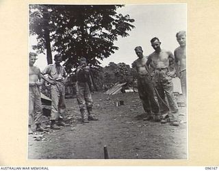 BRANDI, NEW GUINEA, 1945-09-07. PRIVATE N. JOHNSON, 35 INFANTRY BATTALION, PLAYING QUOITS