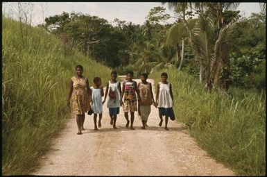 Pedestrians on the road to Yagaum (1) : Madang, Papua New Guinea, 1974 / Terence and Margaret Spencer