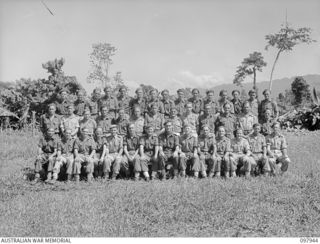 Torokina, Bougainville. 1945-10-12. Group portrait of the members of Headquarters Section, No. 4 Battery, 2nd Field Regiment. Left to right, back row: N456789 Gunner (Gnr) W. Crane of Gundagai, ..