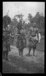 Three individuals with traditional Samoan clothing