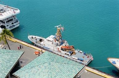 A high-angle port quarter view of the US Coast Guard (USCG) Island Class Patrol Craft, USCG ASSATEGUE (WPB 1337) moored pier side in the harbor at Honolulu, Hawaii (HI), to help promote the start of Safe Boating Week on Oahu