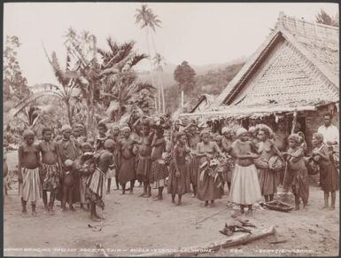 Women of Buala carrying baskets of food for the Southern Cross, Ysabel, Solomon Islands, 1906 / J.W. Beattie