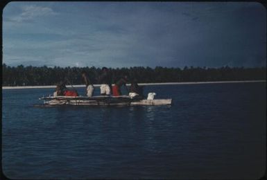 A canoe approaching the main island of the atoll (1) : Mortlock Islands, Papua New Guinea, 1960 / Terence and Margaret Spencer