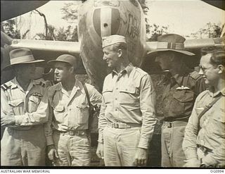 AITAPE, NORTH EAST NEW GUINEA. 1944-04-24. FIRST ALLIED PILOTS TO TRY OUT AIRSTRIP BUILT BY ENGINEERS OF NO. 62 WORKS WING RAAF AT TADJI GREETED BY AIR COMMODORE F. R. W. SCHERGER (EXTREME LEFT) ..