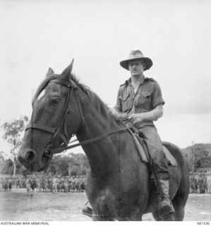 POM POM VALLEY, NEW GUINEA. 1943-11-30. QX6008 LIEUTENANT COLONEL C. C. F. BOURNE, COMMANDING OFFICER, 2/12TH AUSTRALIAN INFANTRY BATTALION, WATCHING THE PARADE