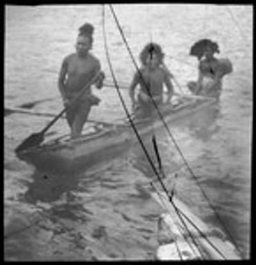 Three men in a canoe