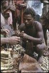 Men with kofu shell money