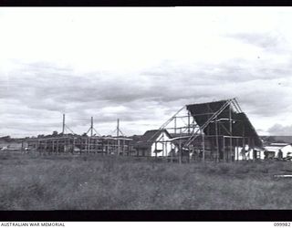RABAUL, NEW BRITAIN, 1946-04-04. JAPANESE LABOURERS BUILDING NEW HOUSES IN THE NEW CHINATOWN AREA, AN AUSTRALIAN NEW GUINEA ADMINISTRATIVE UNIT PROJECT