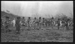 Men of Mambare area dancing in costume, at a gathering