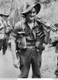 FARIA VALLEY, NEW GUINEA. 1944-02-09. SX18003 PRIVATE D. JONES OF THE 2/10TH INFANTRY BATTALION PICTURED CROSSING THE FARIA RIVER