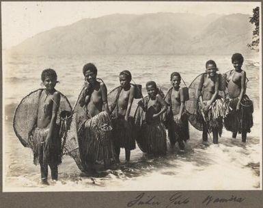 Fisher girls, Wamira [group of girls standing together in the water carrying fishing nets] Frank Hurley