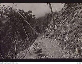 BULLDOG-WAU ROAD, NEW GUINEA, 1943-07-16. A CORNER OF THE ROAD NEAR BANNON'S LOOKOUT