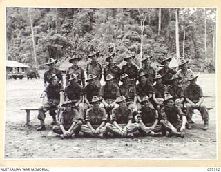 Group portrait of members of 1 Platoon, Headquarters Company, 58/59 Infantry Battalion. Identified, back row, left to right: Private (Pte) H N Best; Pte W Reid; Pte H Hibbert; Pte C Varcoe; Pte J ..