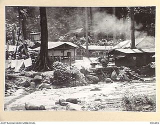 BARGES HILL, CENTRAL BOUGAINVILLE. 1945-06-27. THE CAMP SITE OF 8 FIELD AMBULANCE ADVANCED DRESSING STATION ON THE BANKS OF THE DOIABI RIVER, NUMA NUMA TRAIL
