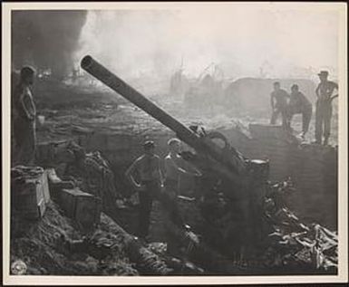 Gun after a direct hit by a [Japanese] bomb, possibly a "Daisy Cutter", while the crew was manning it