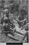 Pig festival, wig ritual: men have placed hair for wigs on an exchange mat