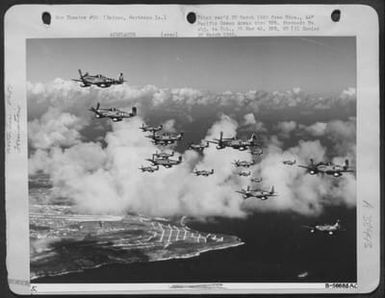 North American P-51 Mustangs Test Their Wings Over Saipan In Preparation For The Move To Iwo Jima. (U.S. Air Force Number B56685AC)